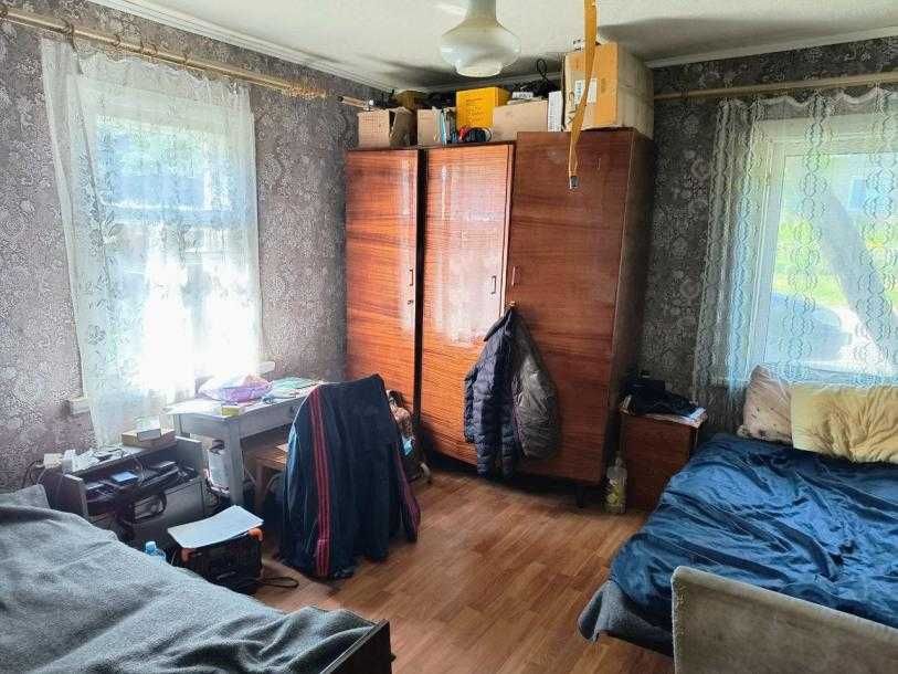 Продам 1/2 дома в центре Змиева