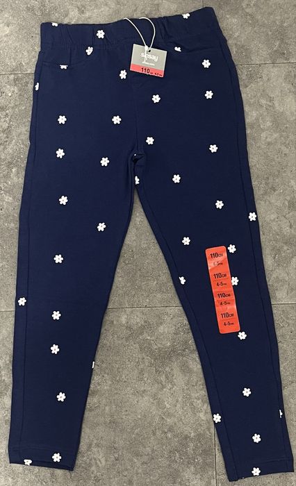Nowe granatowe spodnie legginsy w kwiaty Sinsay rozmiar 110