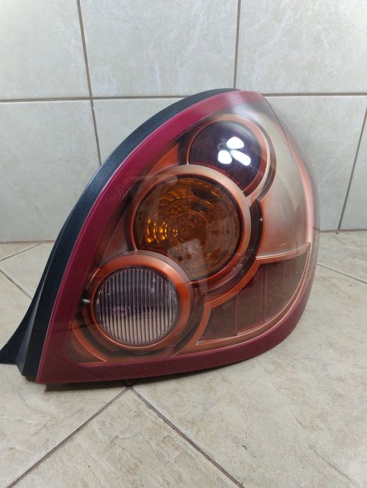 Nissan Almera n16 lift hella lifting lampa prawa tył Europa oryginał