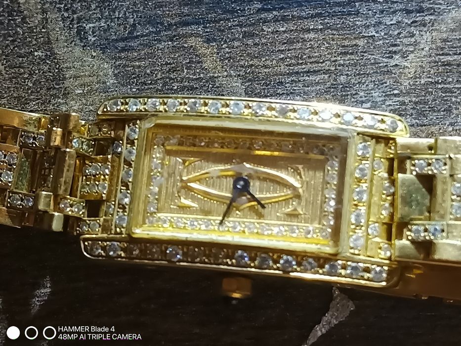 Złoty zegarek, cartier z brylantami, pr.750