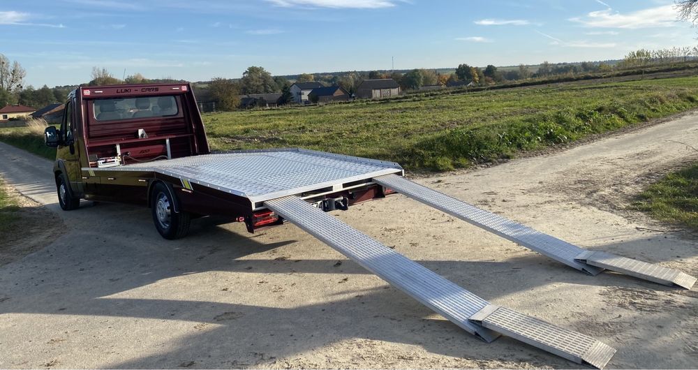 Tani transport laweta pomoc drogowa holowanie autolaweta wynajem kat B