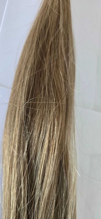 Włosy w kitce ciemny blond waga 44 gram długość 48 cm.
