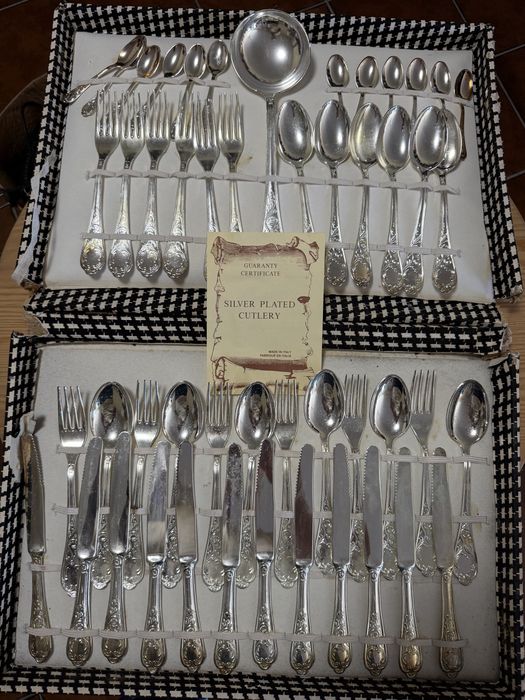 Conjunto de talheres de prata com certificado