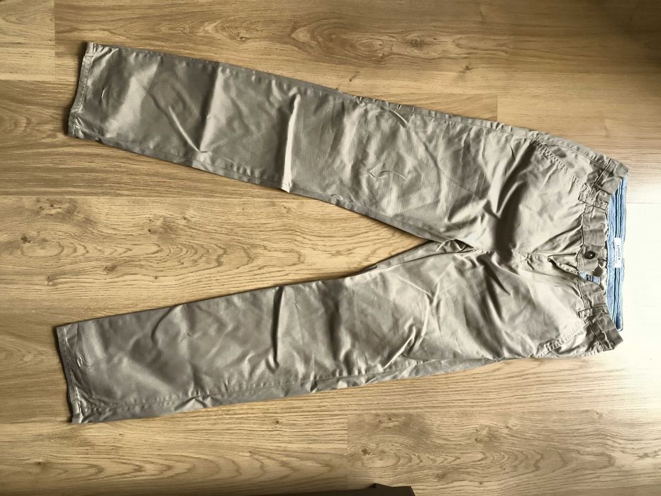 Kremowe eleganckie spodnie chłopięce Lindex, rozmiar 164