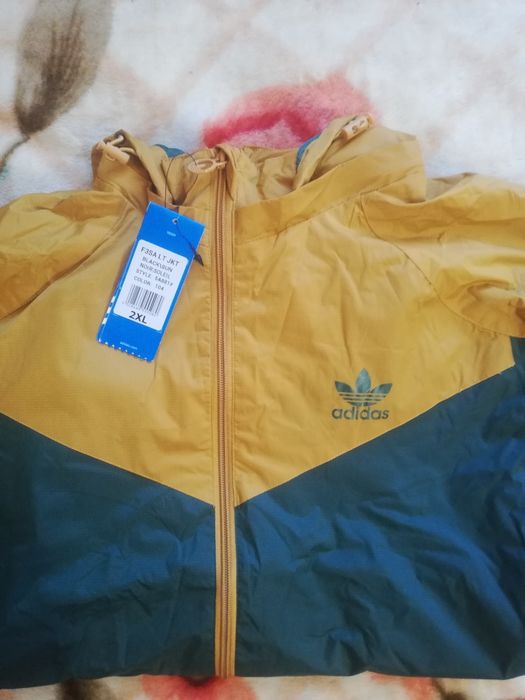 Олімпійки Adidas Originals і куртки весна-осінь The North Face