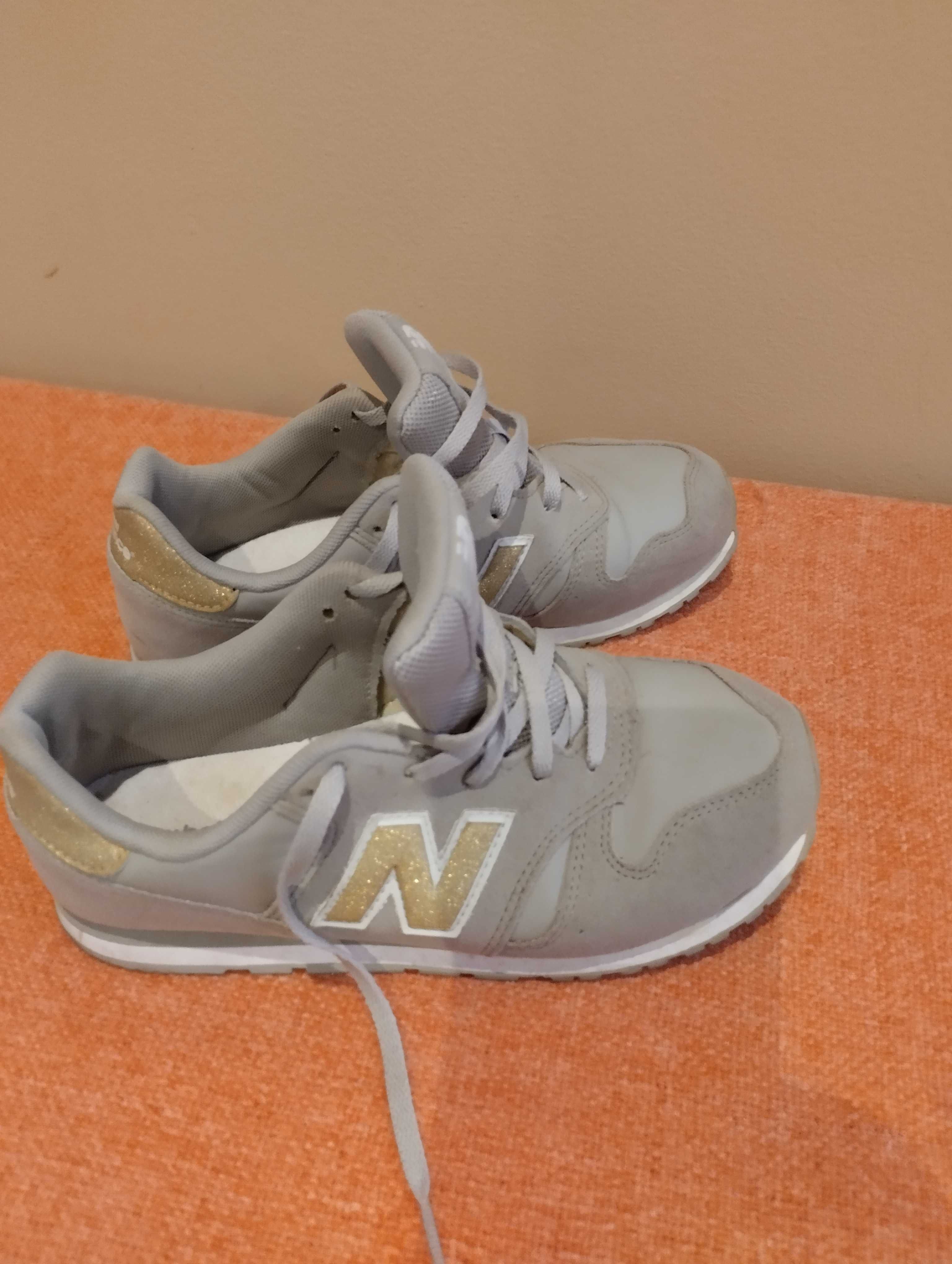 New balance cinza com dourado hotsell