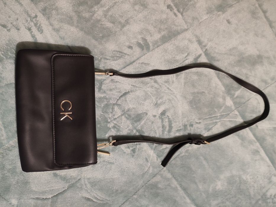 Bolsa/clutch tira colo