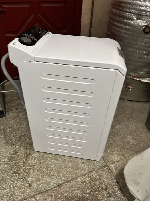 Вертикальна пральна машина AEG 7000 Series 1-7 кг