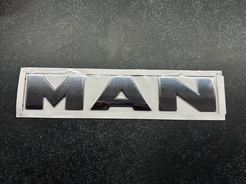 Man Logo znaczek emblemat nowy