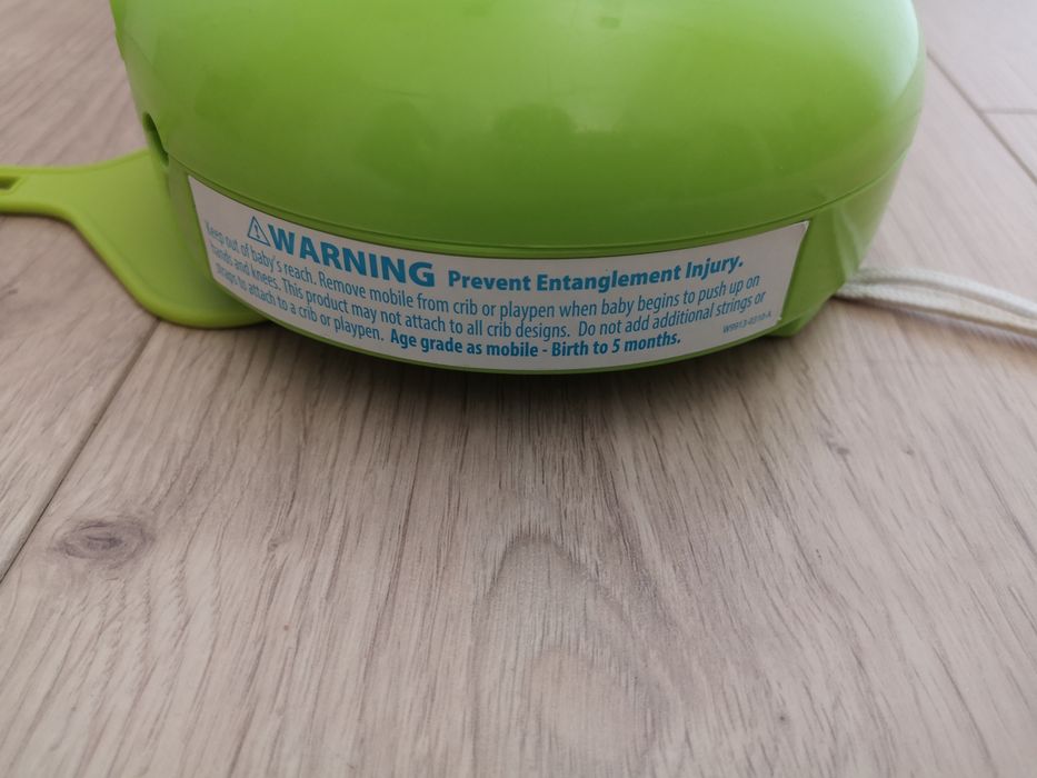 Uspakajacz, szumiś do łóżeczka Fisher Price, zielony. Melodyjki