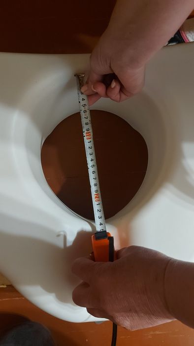 Підвищене сидіння для унітазу з поручнями