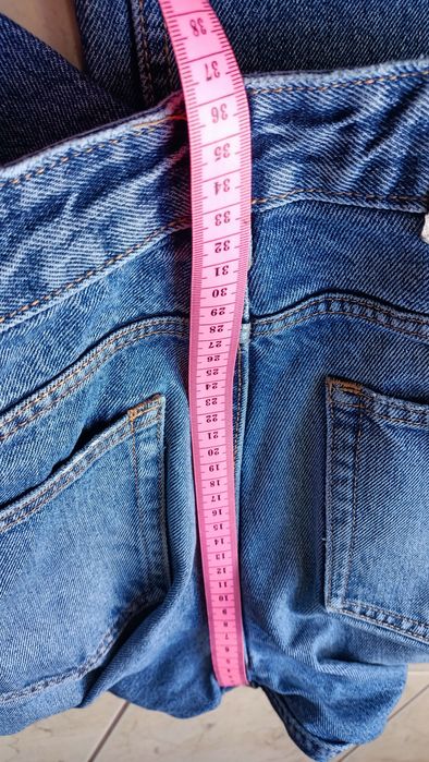 Niebieskie spodnie jeansowe ZARA rozm. 38