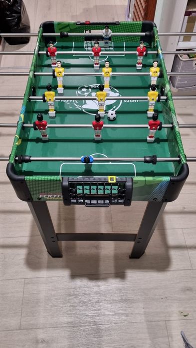 Настольный футбол на штангах.
