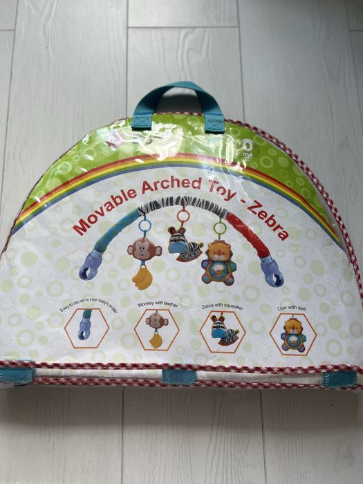 Дуга на коляску, арка з іграшками