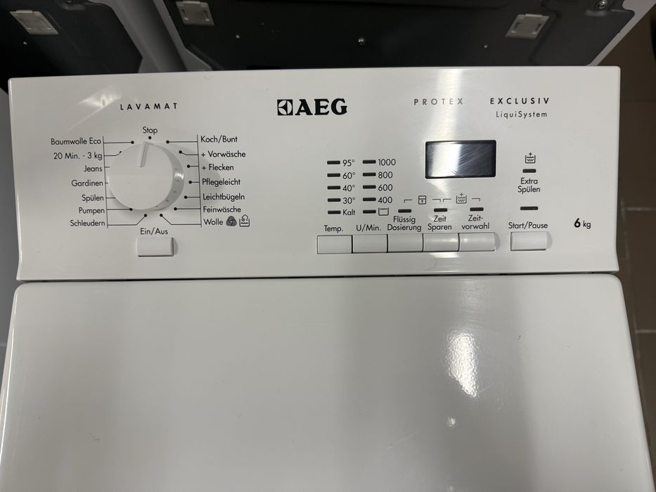 Пральна машина з вертикальним завантаженням AEG