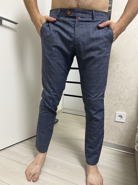 Чоловічі штани у клітинку