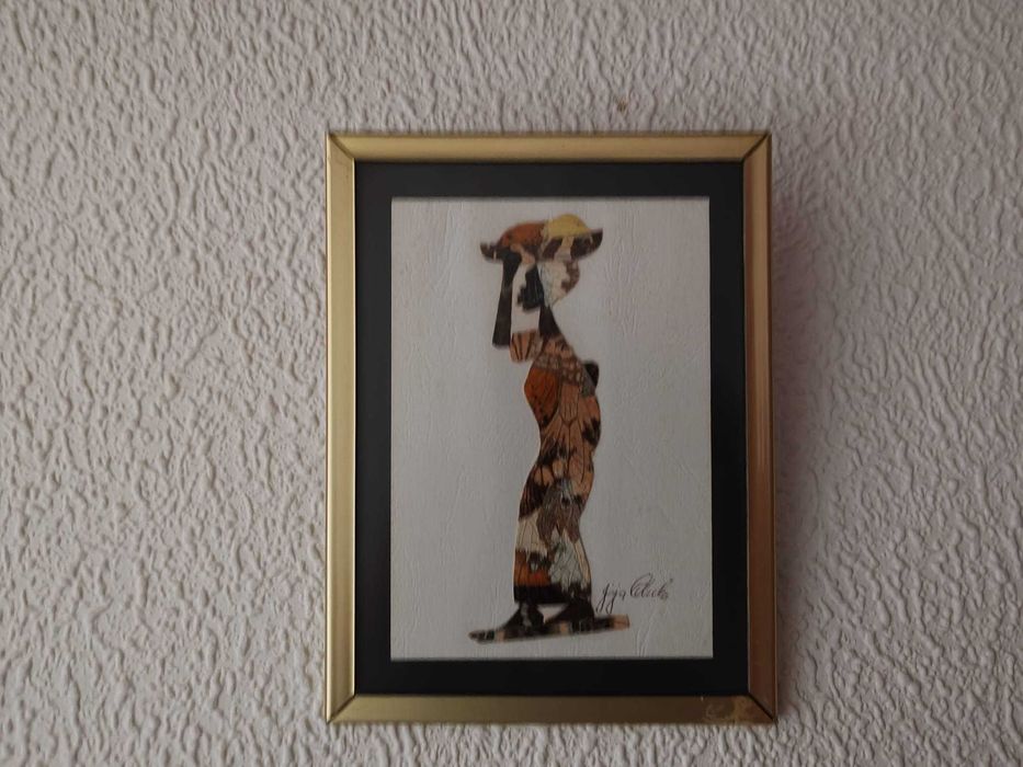 Quadro com moldura em metal.