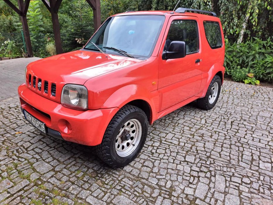Suzuki Jimny Sprzedam Suzuki Jimny – niezawodny, czerwony, terenowy