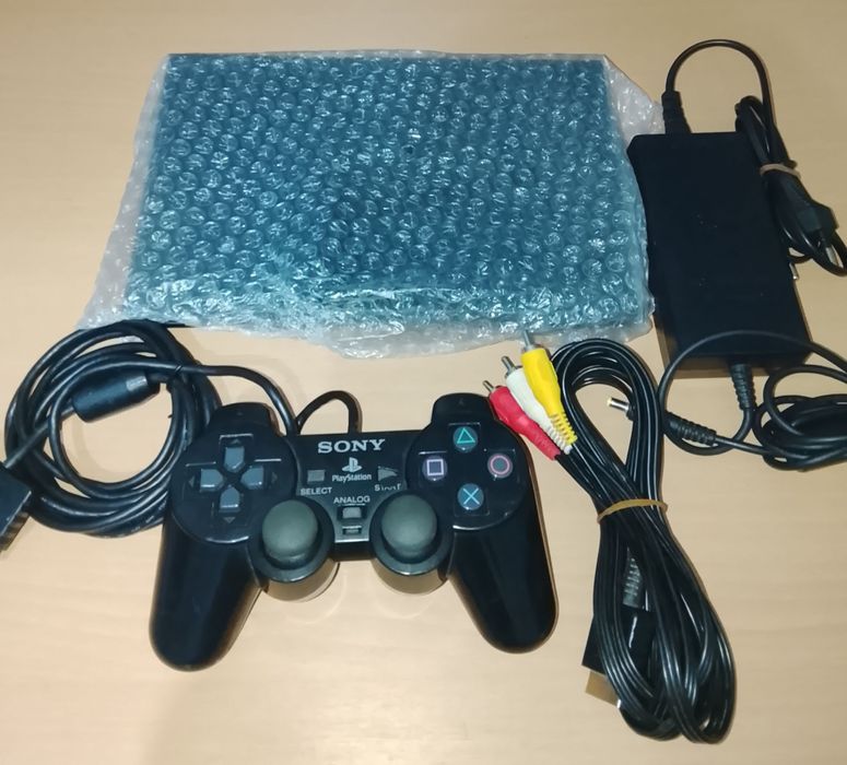 PlayStation 2 Slim + 1 Comando + Cabos