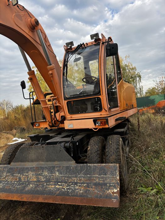 Экскаватор пневмоколісний АМКОДОР EW-1400