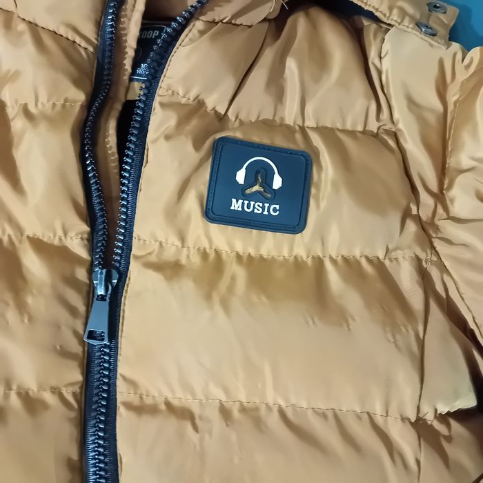 Ruda ciepła kurtka na 140 cm