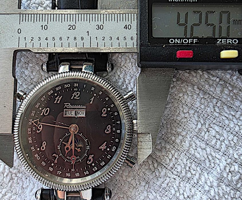 rousseau wristwatch day/date, month indicator, self-winding, water-resistant, gmt work great