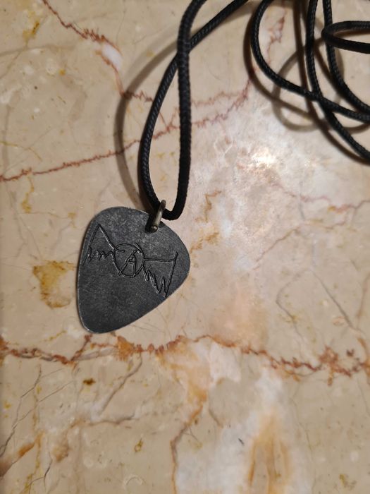 Palheta em Bronze da banda Aerosmith