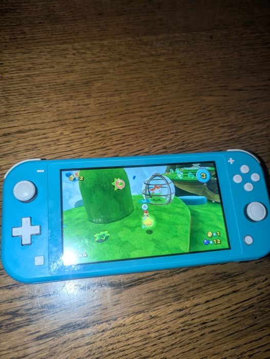 NINTENDO SWITCH LITE 64 + sd карта на 128гб  KeFiR