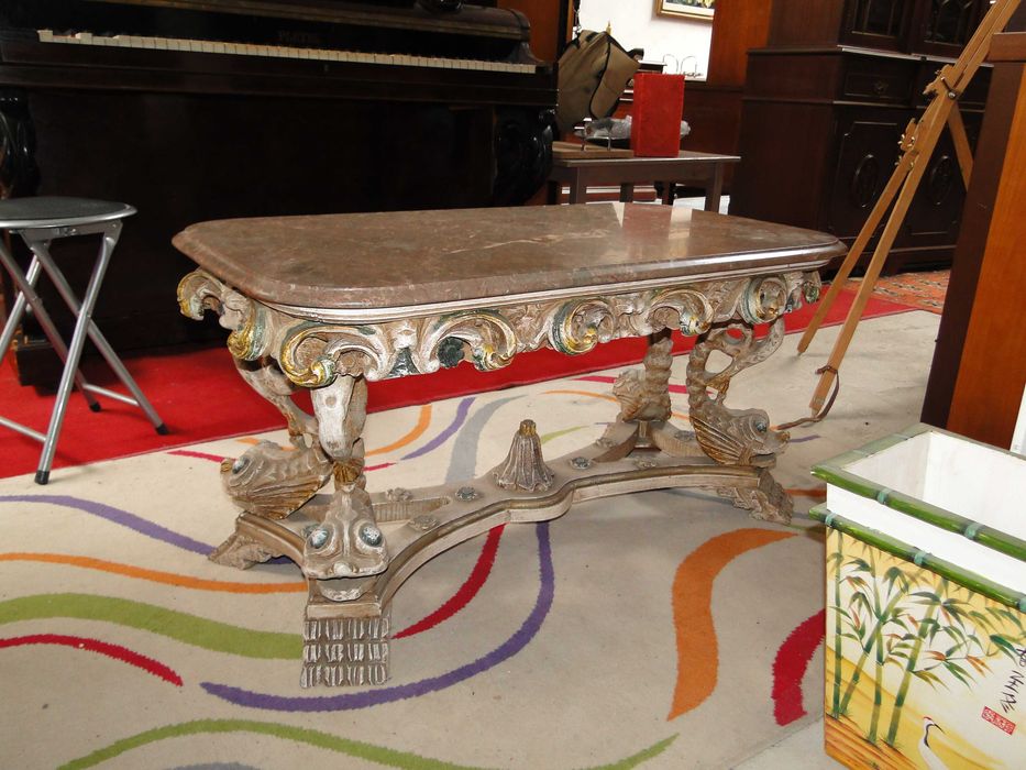 Hand-carved and painted wooden coffee table with stone top