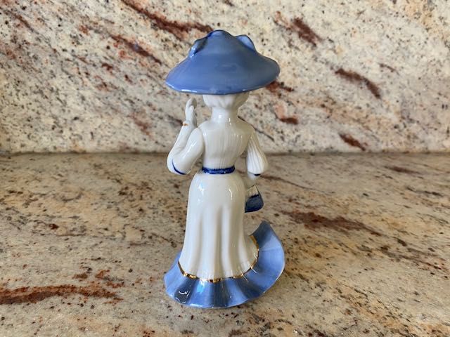 Estatueta em porcelana