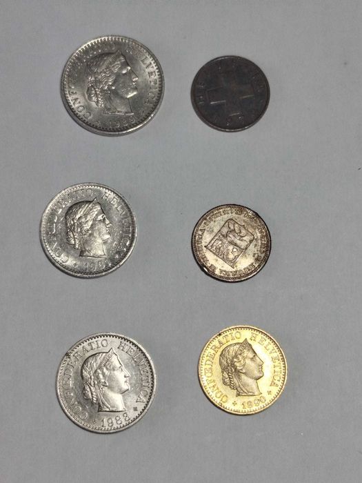 Lote de várias moedas antigas da Suiça