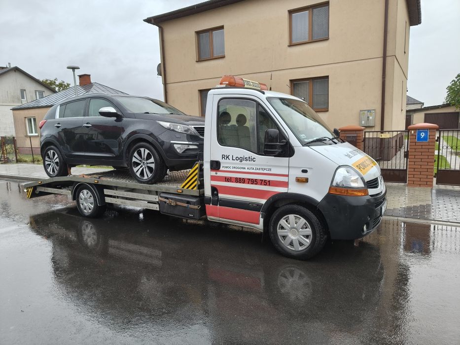 Transport maszyn ciągników holowanie pomoc drogowa  laweta