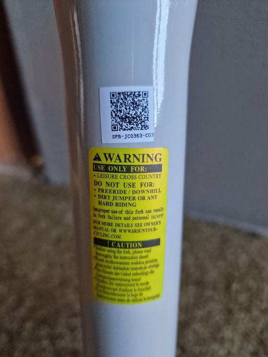 Nowy amortyzator SR Suntour NEX E25 HLO DS 700C tapered, skok 50 mm