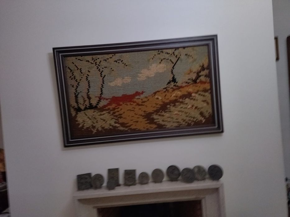 Quadro de tapete bordado