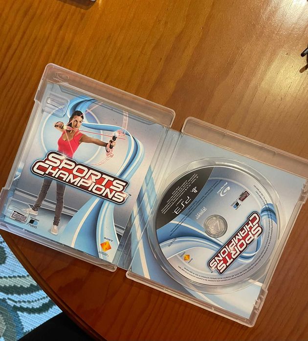 PS3 + Comando de Movimento Move e Câmara + Jogos