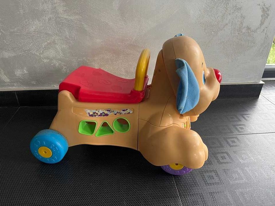 piesek fisher price jeździk