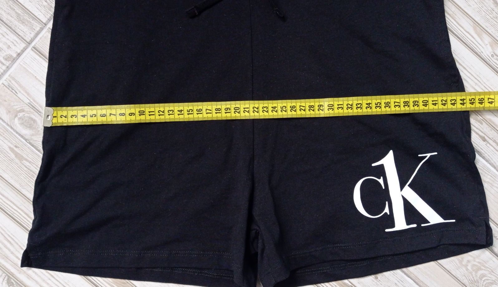 Детский черный комбинезон с логотипом Calvin Klein.