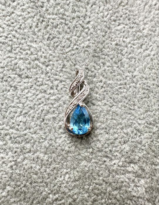 Złoty naszyjnik z topazem 1,15ct i diamentami 0,07ct