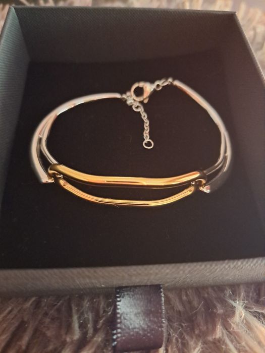 Pulseira em aço prateado e dourado