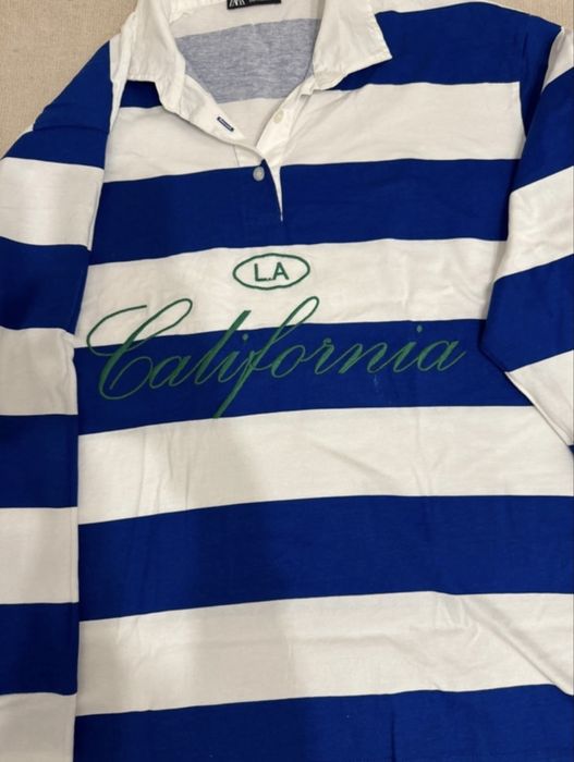 Polo às riscas azuis e brancas zara