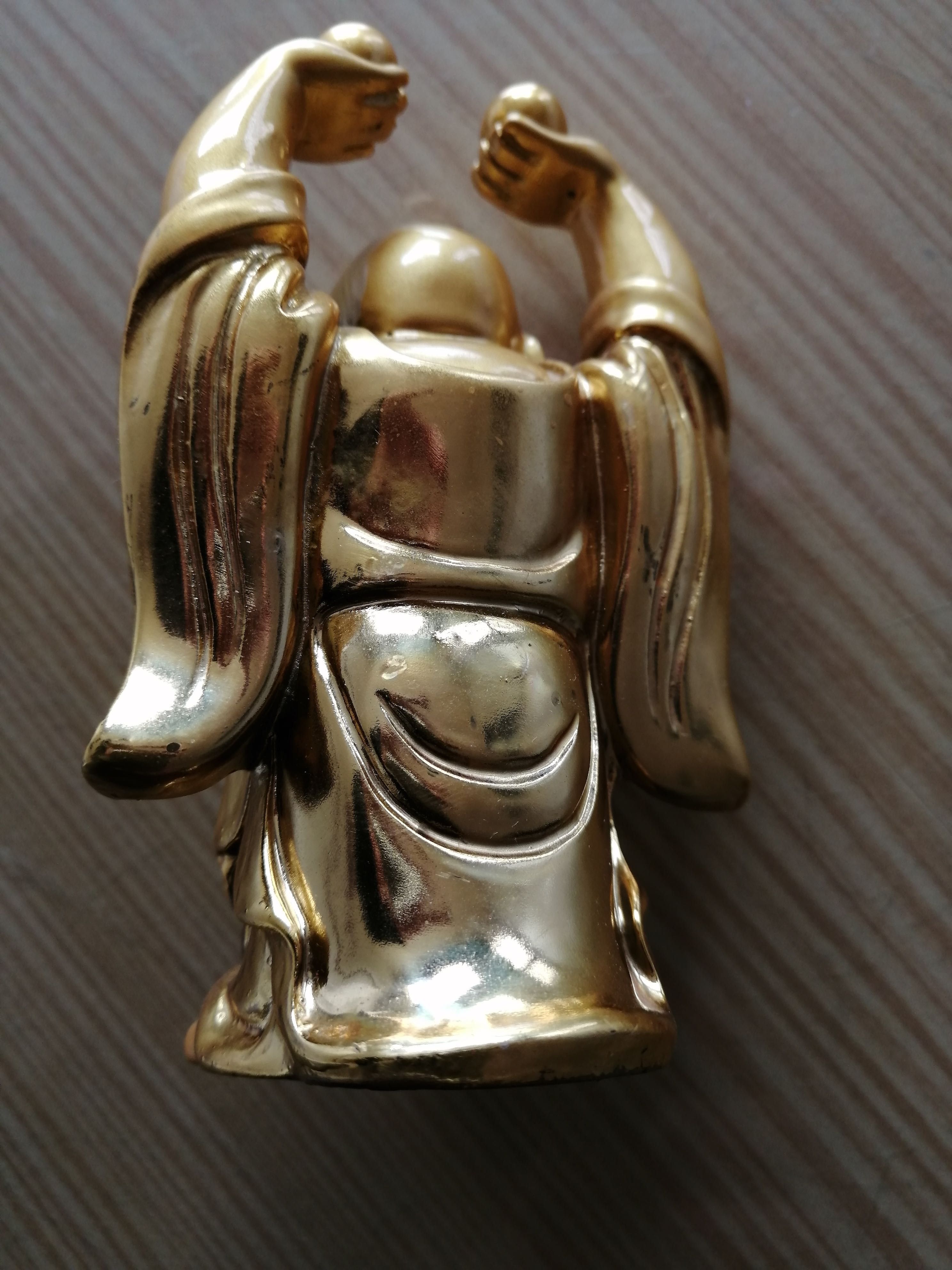 figura de buda em metal