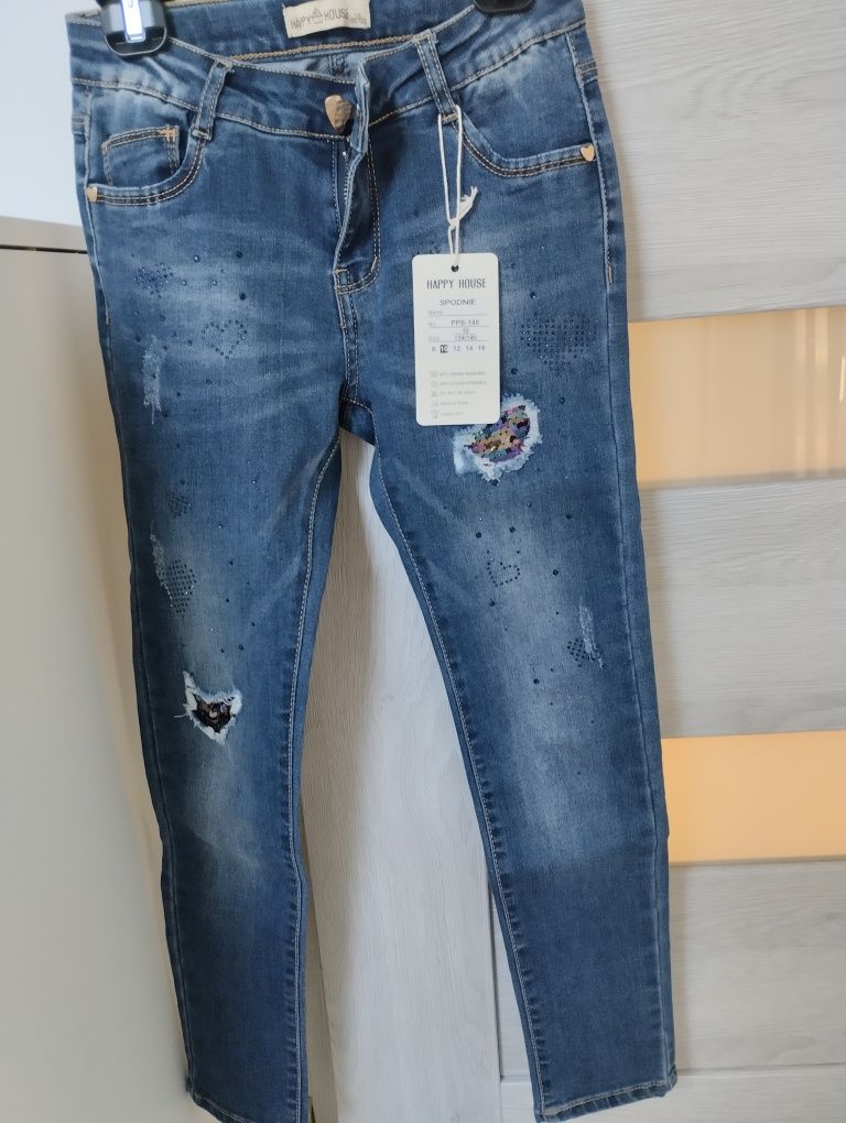 Nowe Spodnie jeansowe rozm 134/140