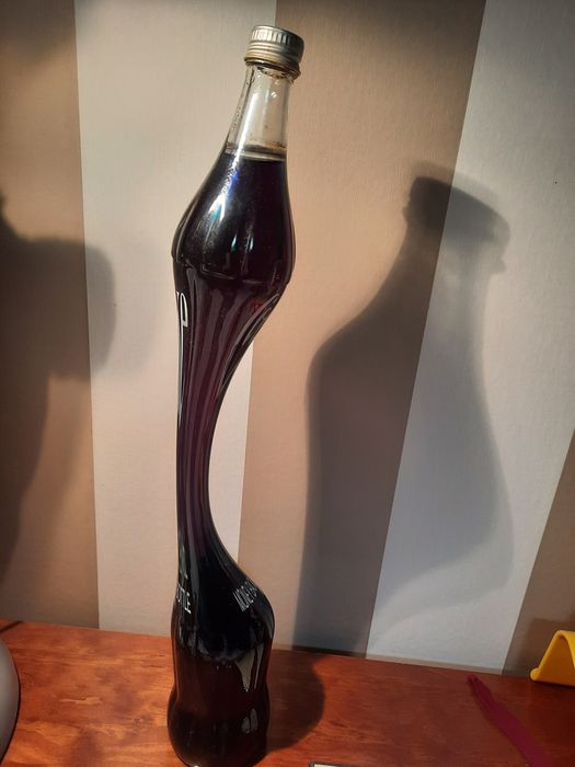 Coca-Cola  de litro, estilizada, 45 anos