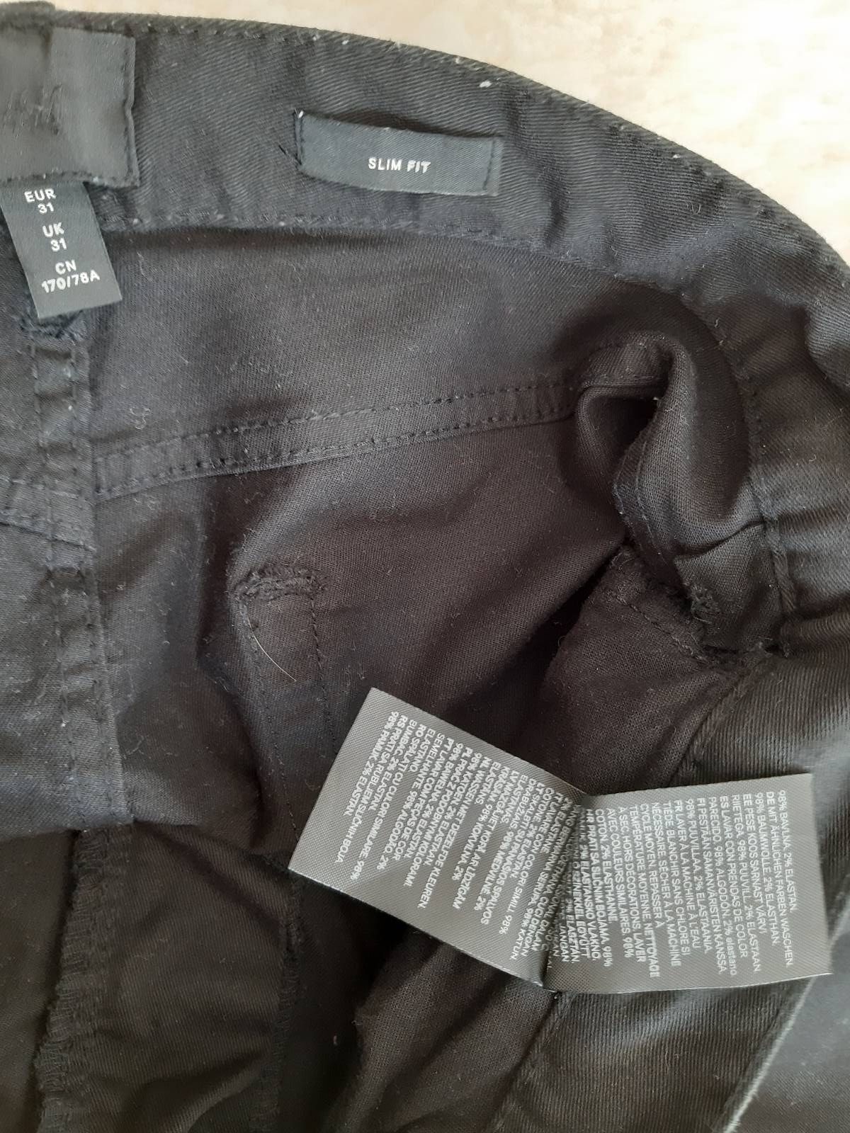 Czarne spodnie jeansowe H&M r. 31