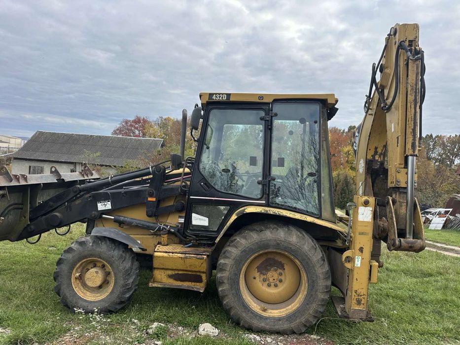 Ескаватор Погрущик Навантажувач Трактор  CAT 432 D жовтий