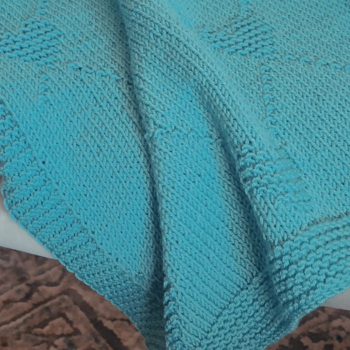 Ręcznie robiony kocyk dla niemowlaka z wełny merino