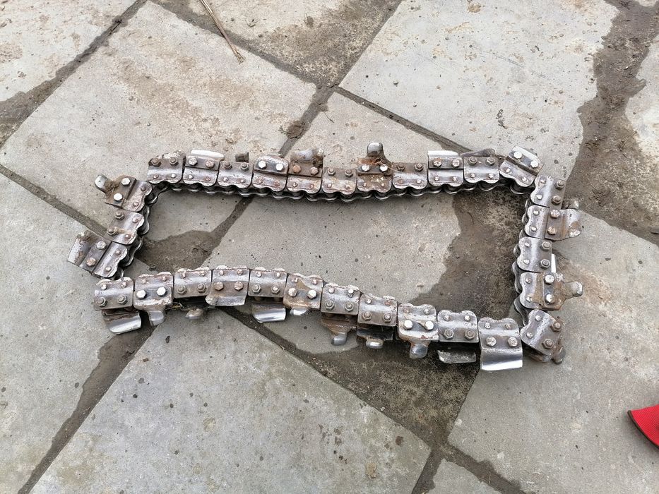 Prowadnica do koparki Barreto 912 Baretto koparka rolka kamien zębatka