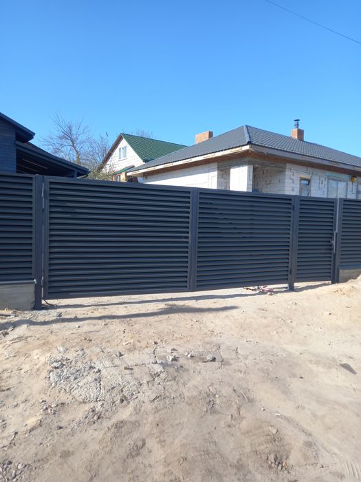 Ворота распашные , откатные , заборы под ключь.