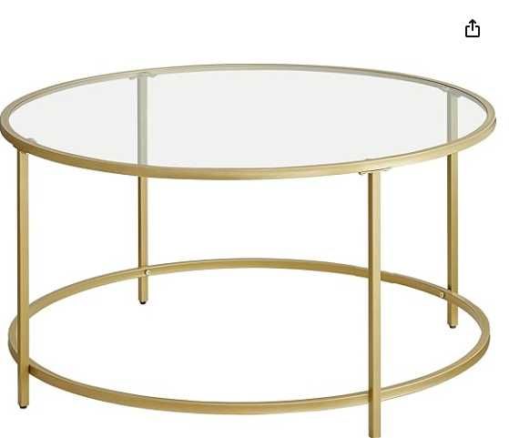 Okragły złoty stolik kawowy ze szklanym blatem
