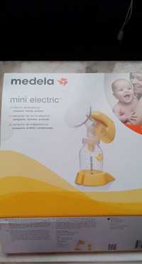 Extrator de leite materno marca Medela a funcionar